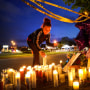Mourners light candles at a makeshift memorial outside of Tops market on May 16, 2022, in Buffalo, N.Y.