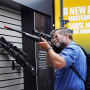 A visitor checks out a rifle at the annual NRA convention in Houston on May 27, 2022.