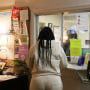 A woman stands at the check-in window of the Hope Medical Group for Women