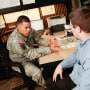 An Army recruiter chats with a potential Army recruit in the City Hall Recruiting Station in New York, on Dec. 17, 2009.