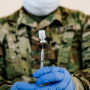 A member of the National Guard prepares a dose of the Pfizer-BioNTech Covid-19 vaccine in New Orleans on Aug. 24, 2021.