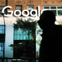 A person walks past Google's offices in New York