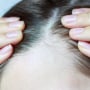 Girl touching her hair close-up, hair loss concept.