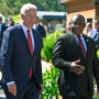 President Joe Biden walks with  South African President Cyril Ramaphosa