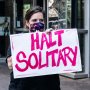 A protester calls for an end to solitary confinement in prisons on June 25, 2020, in New York.
