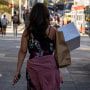 A shopper carries bags in San Francisco, on Sept. 29, 2022.