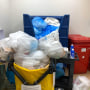 Trash containers overflow with garbage at Health Park Medical Center in Fort Myers, Fla.
