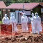 Image: Doctors walk inside the Ebola isolation section of Mubende Regional Referral Hospital, in Mubende, Uganda, on Sept. 29, 2022.