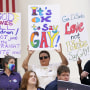 Demonstrators gather to speak on the steps of the Florida Historic Capitol Museum in front of the Florida State Capitol, in Tallahassee, Fla., on March 7, 2022.