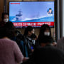 TV screen shows a file image of South Korean navy vessels during a news program at the Seoul Railway Station in Seoul, South Korea, Monday, Oct. 24, 2022.