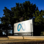 Image: Meta's logo can be seen on a sign at the company's headquarters in Menlo Park, Calif., on Nov. 9, 2022.