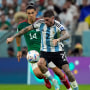Erick Gutierrez and Rodrigo De Paul uring the World Cup group C soccer match between Argentina and Mexico