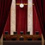 Chairs of U.S. Supreme Court justices sit behind the courtroom bench on July 9, 2019. 