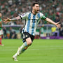 Lionel Messi of Argentina celebrates scoring their team's first goal during a World Cup match against Mexico