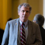 Sherrod Brown departs a Senate Democratic Caucus policy luncheon at the U.S. Capitol.