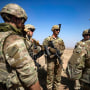 U.S. soldiers attend a joint military exercise between forces of the U.S.-led "Combined Joint Task Force-Operation Inherent Resolve" coalition against the Islamic State (IS) group and members of the Syrian Democratic Forces