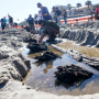  Severe beach erosion caused by two late-season hurricanes helped partially uncover what appears to be part of an 80-foot-long (24-meters) ship in the sand on Daytona Beach Shores, officials said. (AP Photo/John Raoux)