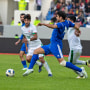 Kuwait's Bader Tareq, center, fights for the ball during a friendly  match between Kuwait and Iraq at the Sports City Stadium in Basra, Iraq, on Dec. 30, 2022.