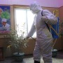 FILE- An official of the Hygienic and Anti-epidemic Center in Phyongchon District disinfect the corridor of a building in Pyongyang, North Korea, on Feb. 5, 2021. The Korean Central News Agency said Thursday, May 12, 2022, tests from an unspecified number of people in the capital Pyongyang confirmed that they were infected with the omicron variant.