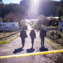 FBI officials walk towards the crime scene at Mountain Mushroom Farm on Jan. 24, 2023. 