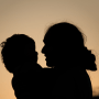 Silhouette of a mother with baby