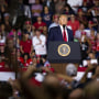 Then-President Donald Trump pauses during his speech at a rally in Manchester, N.H. on Aug. 15, 2019. 