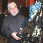 Image: Spanish Designer Paco Rabanne checks a dress before his 1999 Spring/Summer haute-couture collection, in Paris on Jan. 20, 1999.