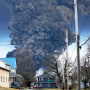 A black plume rises over East Palestine, Ohio, as a result of a controlled detonation of a portion of the derailed Norfolk and Southern trains Monday, Feb. 6, 2023.