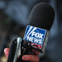 A person walks past the Fox News headquarters in New York City