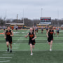 Members of Robert Lee ISD’s middle and high schools warm up before a track meet in Robert Lee, Texas on March 9, 2023.
