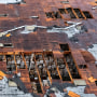 Damage to a building is seen on Wednesday, March 22, 2023 in Montebello, Calif., after a possible tornado. (AP Photo/Ringo H.W. Chiu)
