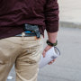 A person carries a gun in their waistband during an election protest in Detroit