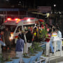 Rescue workers unload earthquake victims from an ambulance at a hospital in Saidu Sharif, a town Pakistan's Swat valley, Tuesday, March 21, 2023. 