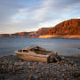 Image: A formerly sunken boat sits high and dry along the shoreline of Lake Mead at the Lake Mead National Recreation Area, on May 10, 2022, near Boulder City, Nev.