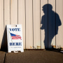 Image: A voter walks toward the entrance of the Boys and Girls Clubs of the Great Lakes Bay Region to cast their ballot in Bay City, Mich., during Election Day on Nov. 3, 2020.