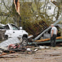 A man surveys the debris outside his destroyed home on April 5, 2023 in Glenallen, Mo.