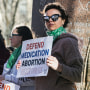A woman protests in support of access to abortion medication on March 15, 2023 in Amarillo, Texas.