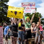 Counter protesters hold sings in favor of abortion and against an anti-abortion prayer circle in Toledo, Ohio on June 25, 2022.