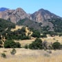 FILE - This July 1, 2018 file photo shows Malibu Creek State Park near Calabasas, Calif. The arraignment of a parolee charged with killing a man camping with his daughters at a Southern California state park in June and shooting at 10 people over the past two years has been postponed. Prosecutors said Monday, Jan. 7, 2019, that arraignment for Anthony Rauda was continued until Jan. 22 in Los Angeles County Superior Court.