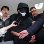 A man who opened an emergency exit door during a flight arrives to attend an arrest warrant review at the Daegu District Court in Daegu, South Korea, on May 28, 2023.