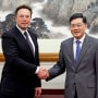 Elon Musk shakes hands with China's Foreign Minister Qin Gang in Beijing on May 30, 2023. 