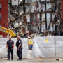 Police continue to secure a six-story apartment building on May 29, 2023, in Davenport, Iowa, after it collapsed the day before.