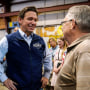 Image: Republican presidential candidate Florida Gov. Ron DeSantis talks with an audience members during a campaign event at Port Neal Welding on May 31, 2023, in Salix, Iowa.