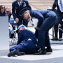 President Joe Biden is helped up after falling during the graduation ceremony