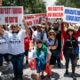 Syndication: Marchers protest the new controversial immigration law, SB 1718, that was signed into law by Florida Governor Ron DeSantis, in downtown West Palm Beach, Fla., on June 1, 2023.
