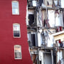 Search and rescue effort continue at a six-story apartment building on June 4, 2023, nearly a week after a section of the building collapsed in Davenport, Iowa.