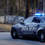 Law enforcement drive past the planned site of a police training facility that activists have nicknamed "Cop City," near Atlanta on Feb. 6, 2023.