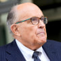 FILE - Rudy Giuliani speaks with reporters as he departs the federal courthouse, May 19, 2023, in Washington. Giuliani, the former mayor of New York City, says a woman’s lawsuit alleging he coerced her into sex and owes her nearly $2 million in unpaid wages is “a large stretch of the imagination” filled with exaggerations and salacious details “to create a media frenzy.”