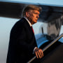 Former President Donald Trump boards his airplane, known as "Trump Force One," after speaking at a campaign event, at the Manchester-Boston Regional Airport on April 27, 2023, in Manchester, N.H.