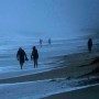 People walk along the oceanfront at Jensen Beach Park ahead of the arrival of Hurricane Nicole on Nov. 9, 2022, in Jensen Beach, Fla.
